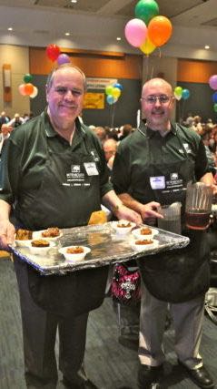Rick and Ron Betenbough, founders of Betenbough Homes, serving at luncheon